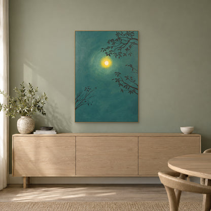 Green moon and branches painting in a champagne-tone frame above an oak-toned sideboard