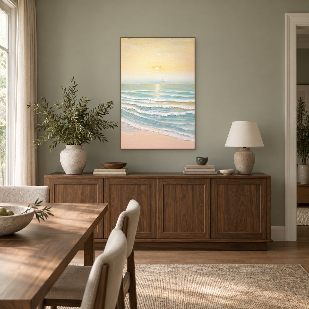 Morning Tide pastel seascape in a champagne-tone floating frame above a dining-room sideboard