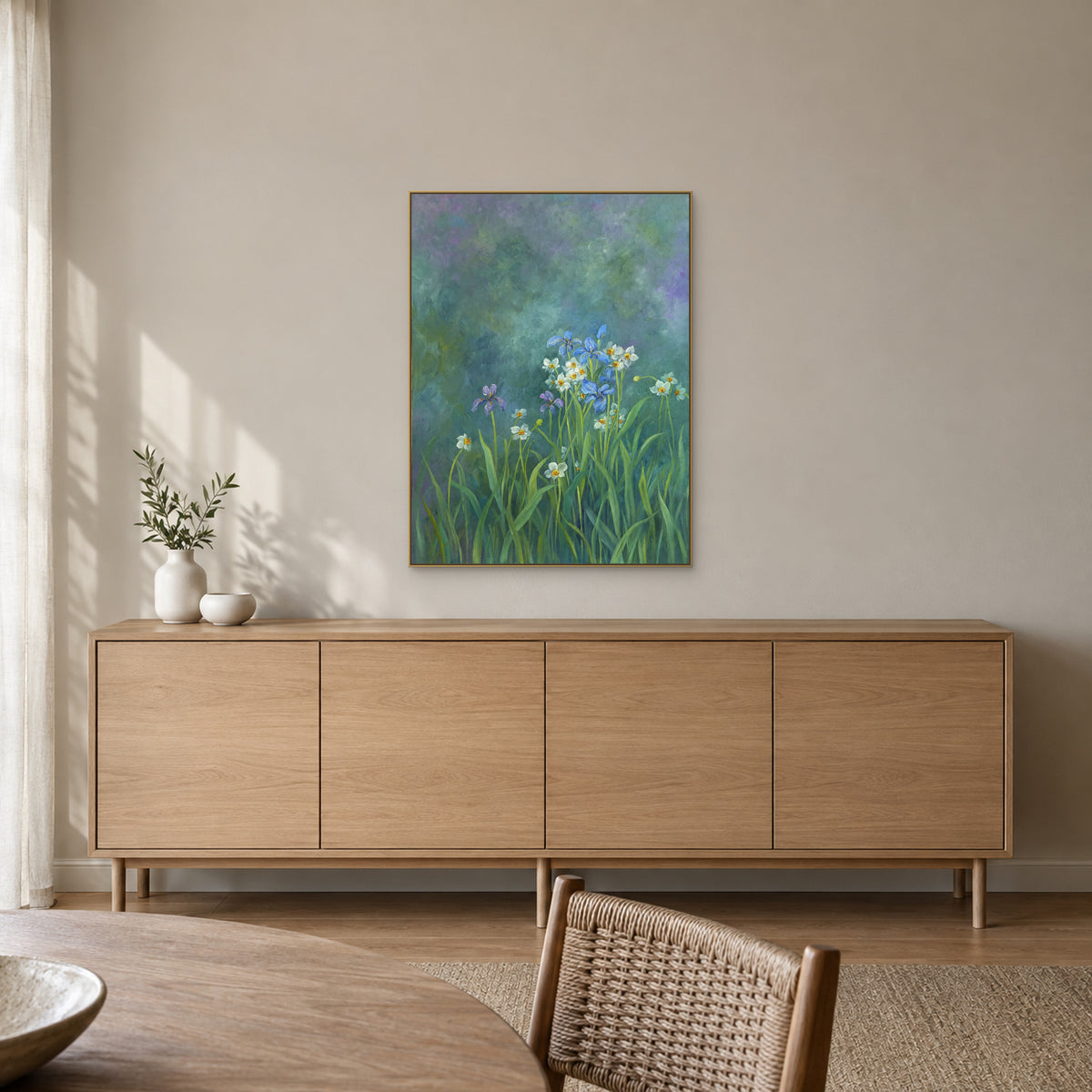 Blue iris wall art in a champagne-tone frame above a light oak sideboard in a softly lit dining room