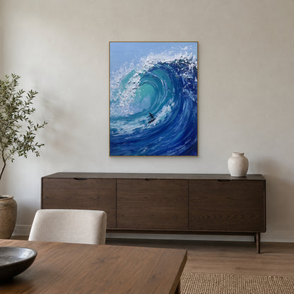 Champagne-framed turquoise wave and surfer painting above a dark wood sideboard in a dining room