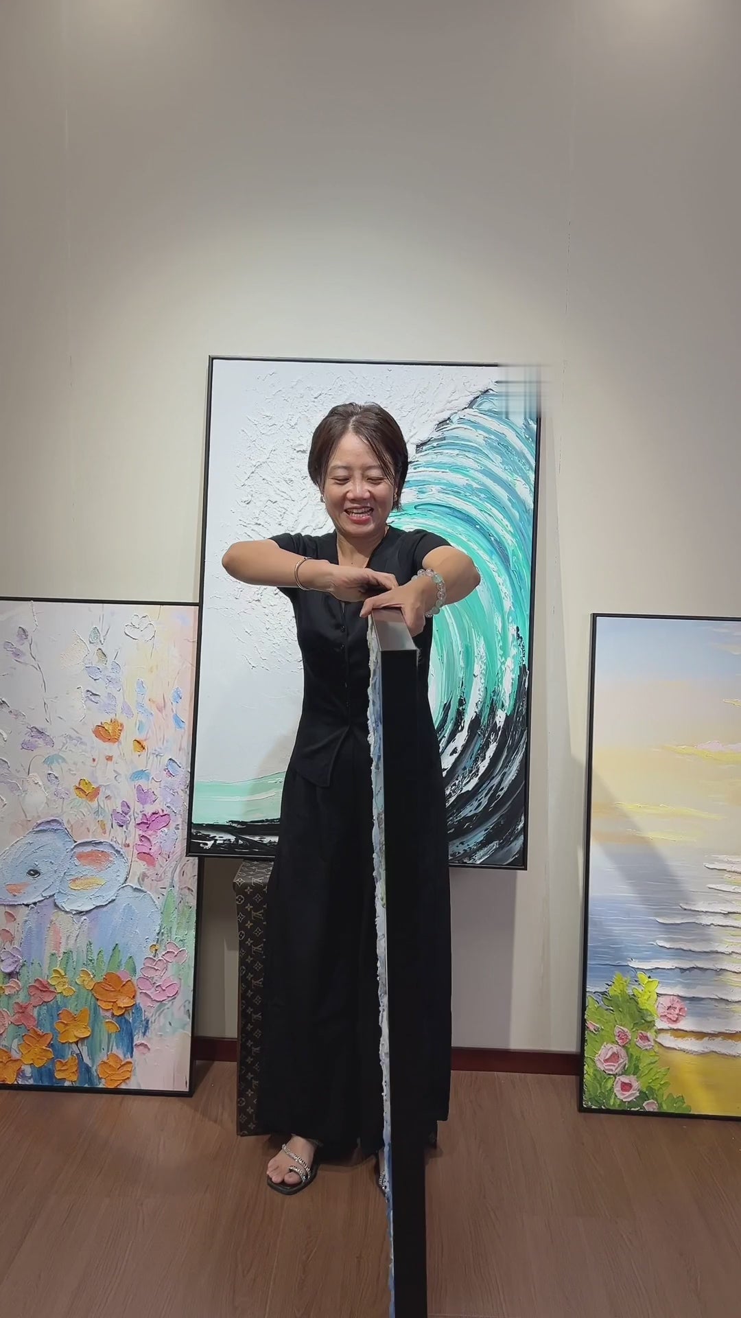 A blue floral painting turned to the front, followed by close views of raised petals, flower centres and leaves