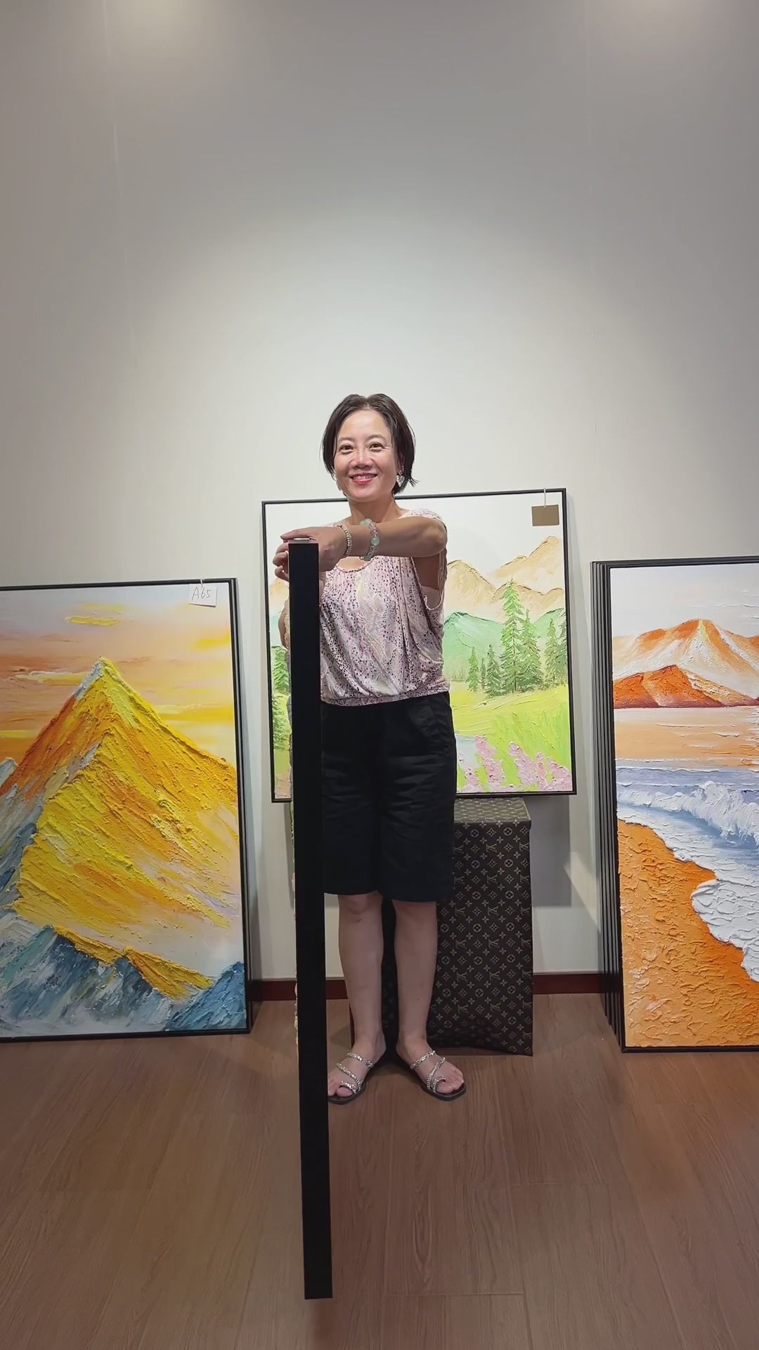 Supplier turns the pastel butterfly artwork to the front, followed by a framed wall presentation