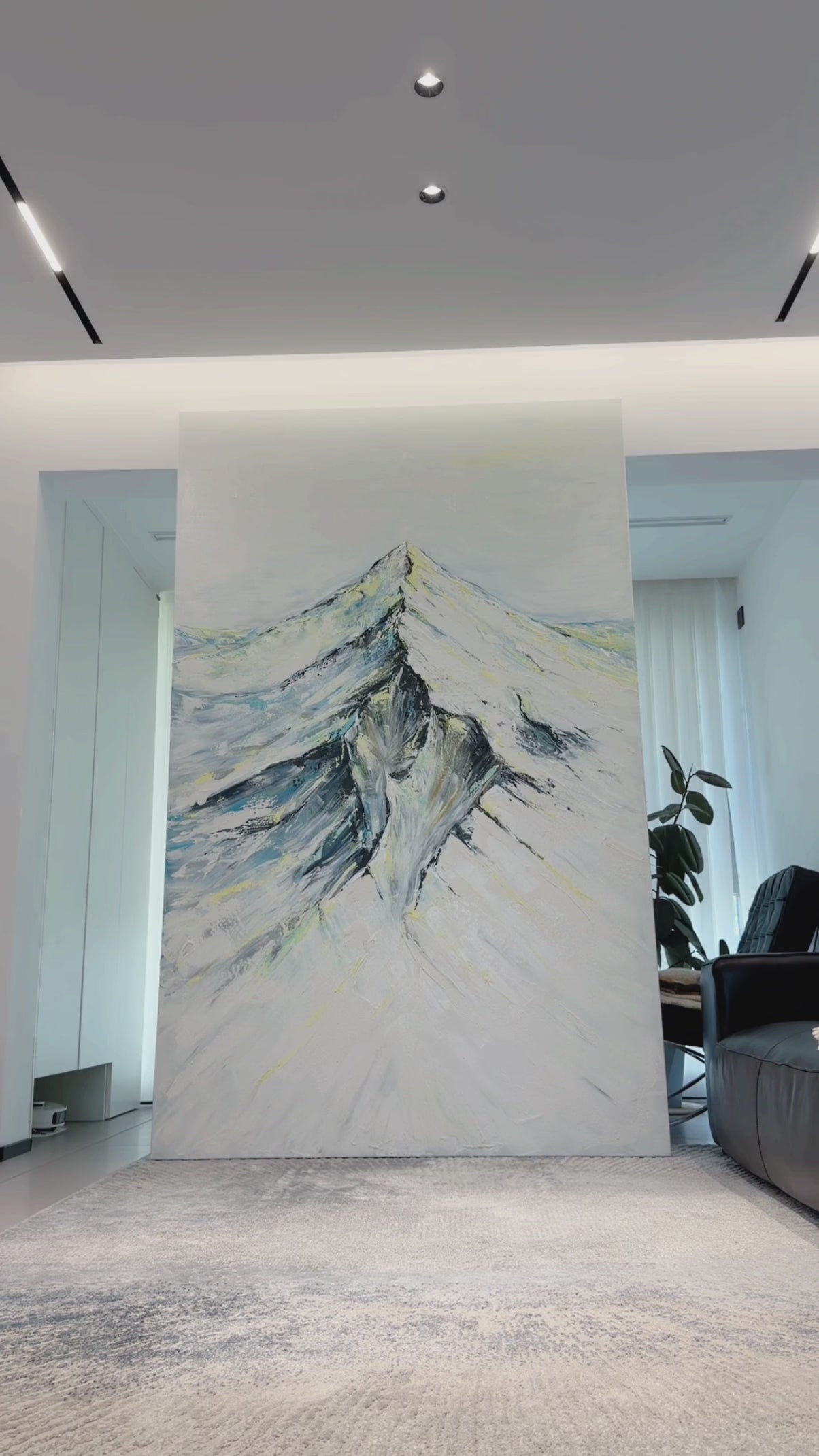 Video showing the full snowy mountain painting, its raised surface and the completed artwork