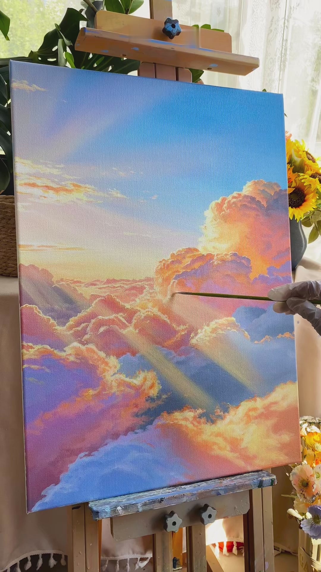 Hand-painting a luminous cloudscape, from the blue sky and warm cloud layers to diagonal sunbeams and the finished painting