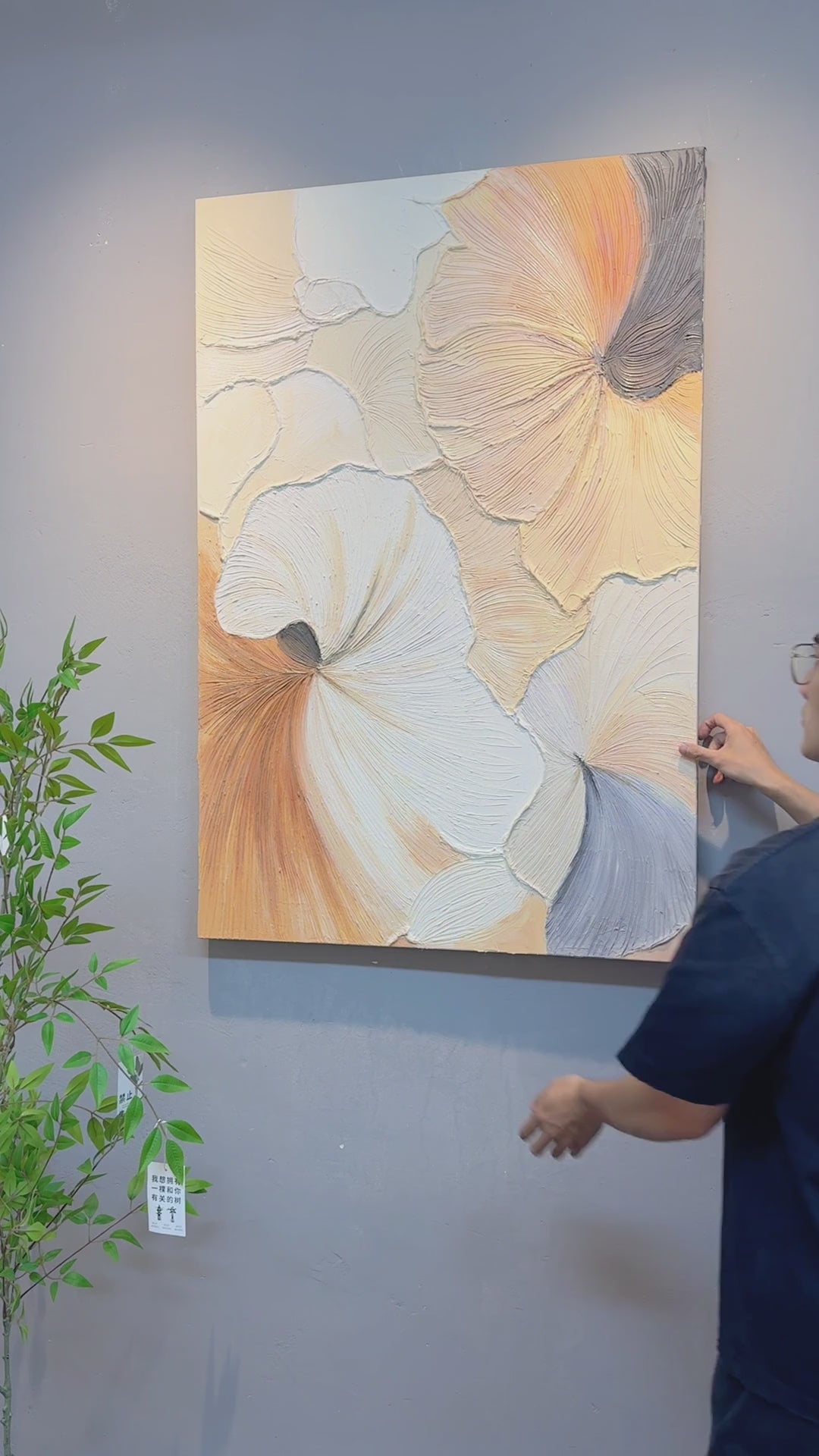 Full view of the pastel abstract, a hand touching the raised surface, oblique texture details and a final complete view