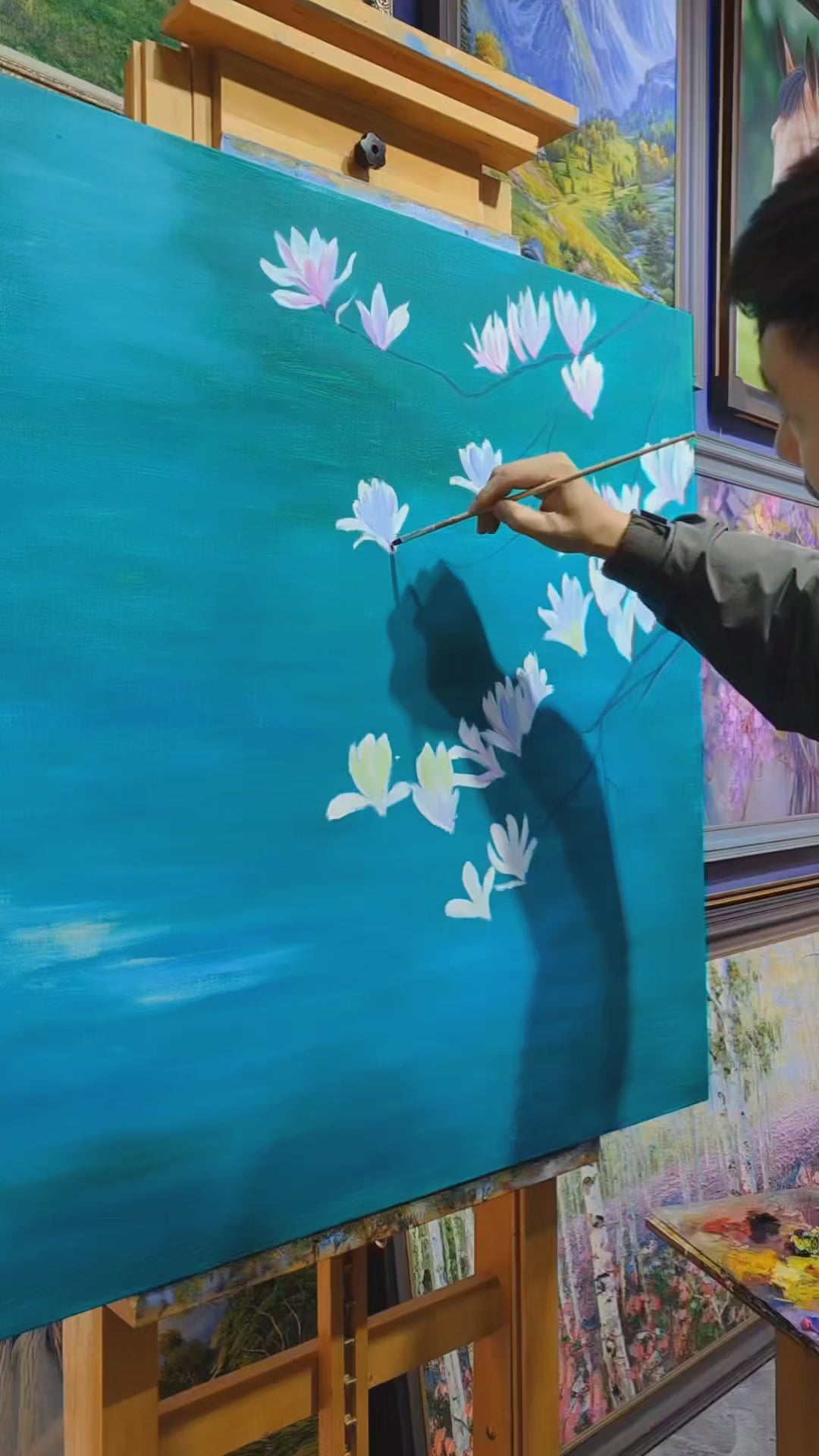 Brush painting of magnolia petals, pond reflections and lily pads, followed by koi details and the finished painting