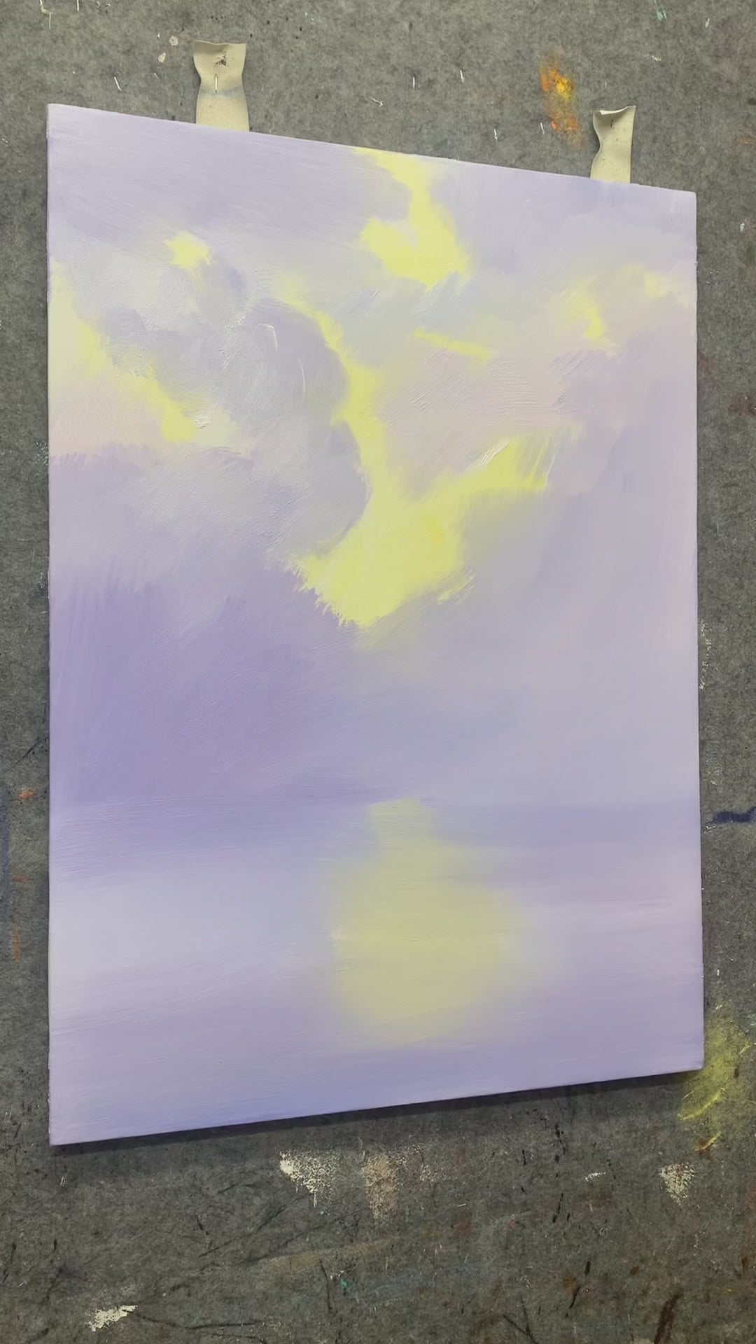 Clouds, light rays, water reflections and a tiny sailboat are painted by hand before the finished pastel seascape is shown.