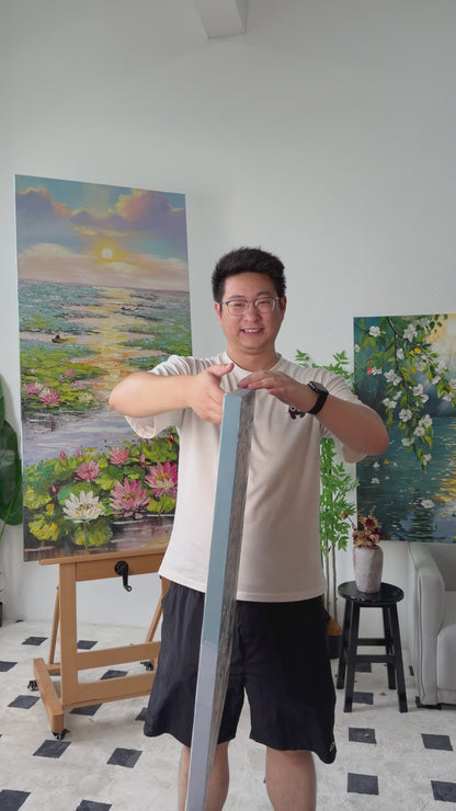 Studio video turning the painting from a narrow side view to a full view of a woman in a flowing dress beside the sea